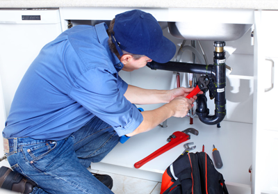 Plumber in North Miami Beach installs a J trap